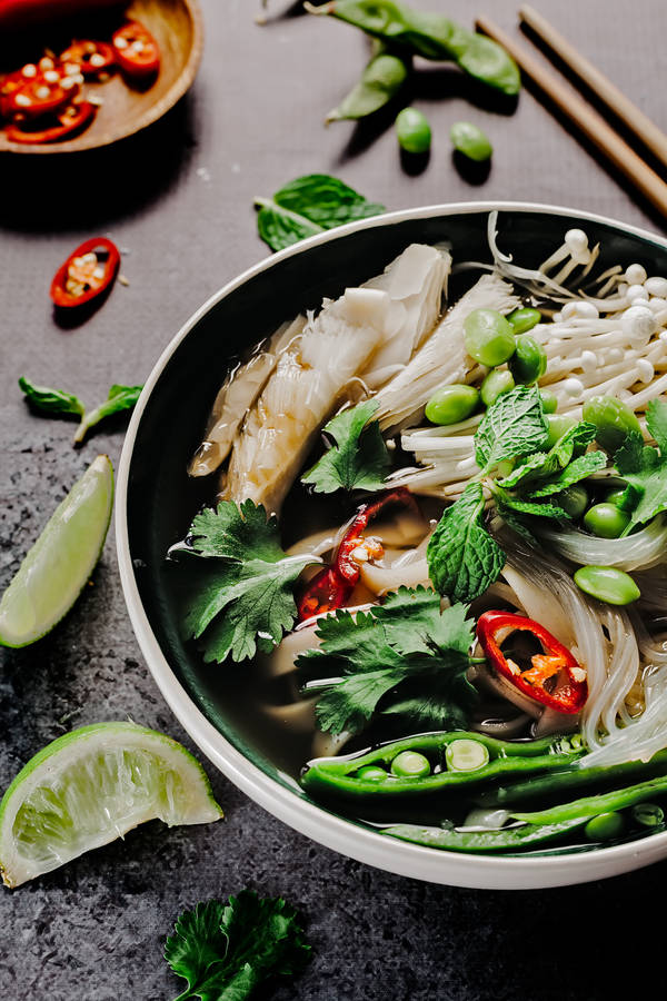 A Satisfying Bowl Of Pho: Traditional Vietnamese Noodle Soup With Fresh Vegetables. Wallpaper