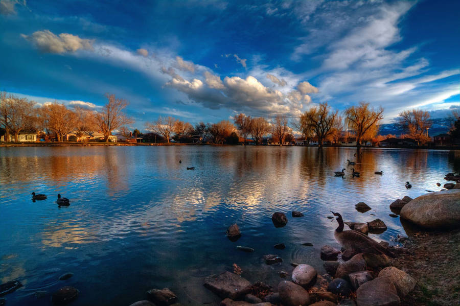 A Serene Sunrise Over Lake Reno Wallpaper