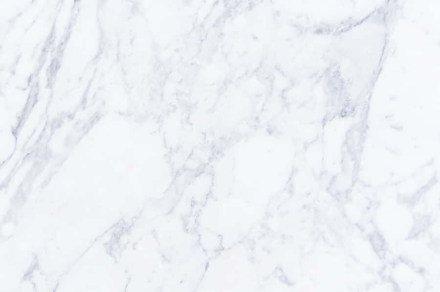 A Sleek And Stylish Marble Macbook Brings Luxury To Everyday Computing Wallpaper