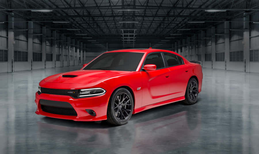 A Sleek, Black Dodge Charger Speeds Down An Open Highway, Showcasing Its Powerful Design And Performance. Wallpaper