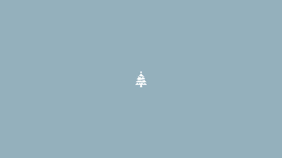 A Small Christmas Tree On A Blue Background Wallpaper