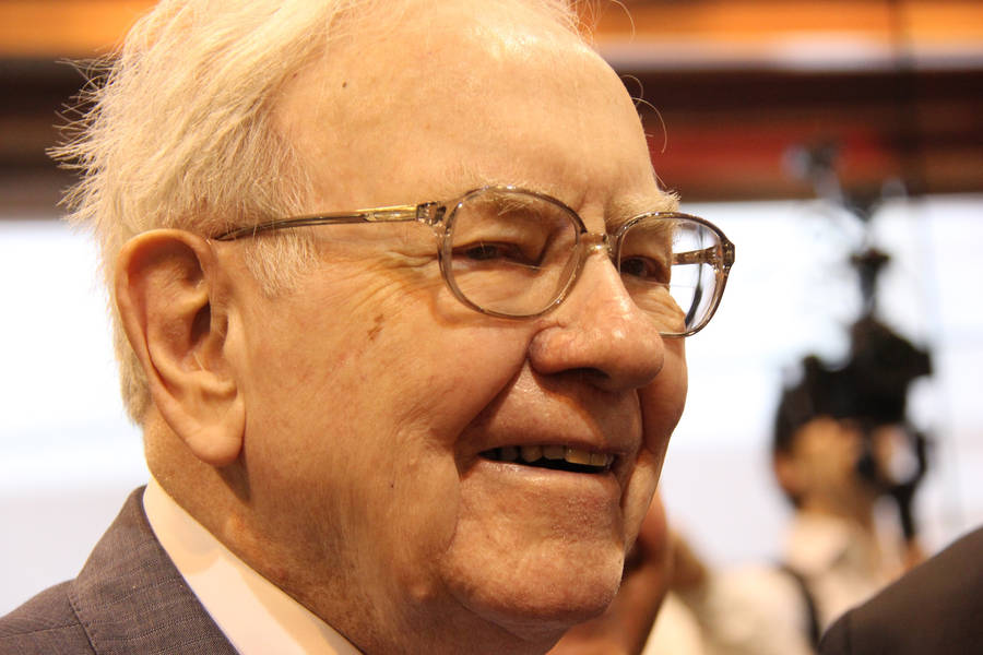 A Smiling Side Profile Of Warren Buffett Wallpaper