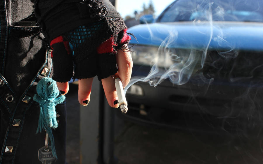 A Smoldering Cigarette On Ashtray Wallpaper