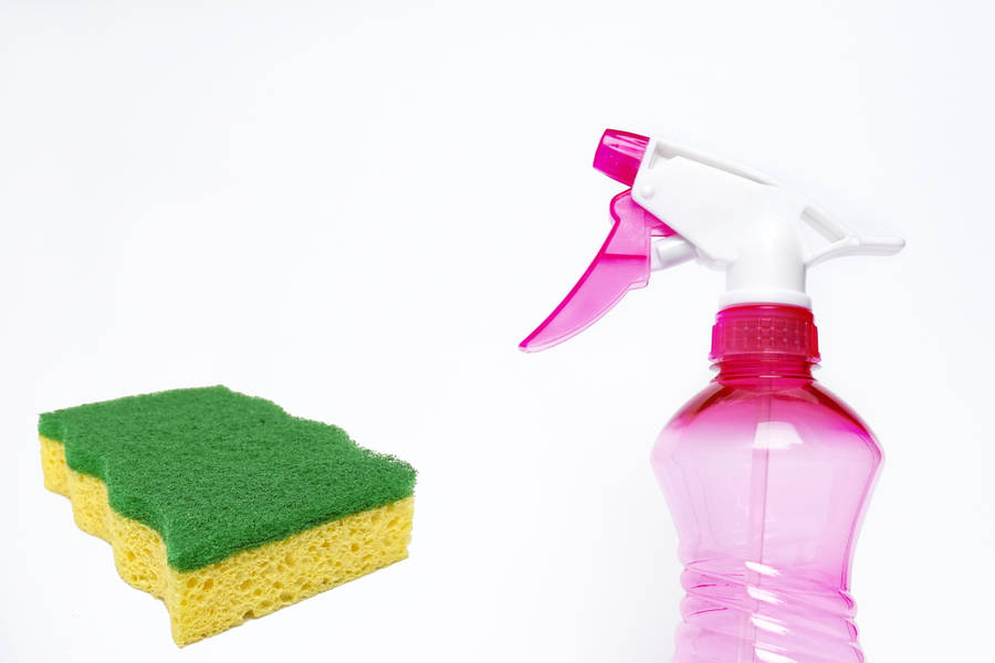 A Sponge And Spray Bottle Ready For House Cleaning Wallpaper