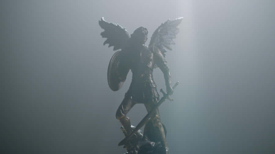 A Statue Of An Angel With A Shield In The Light Wallpaper