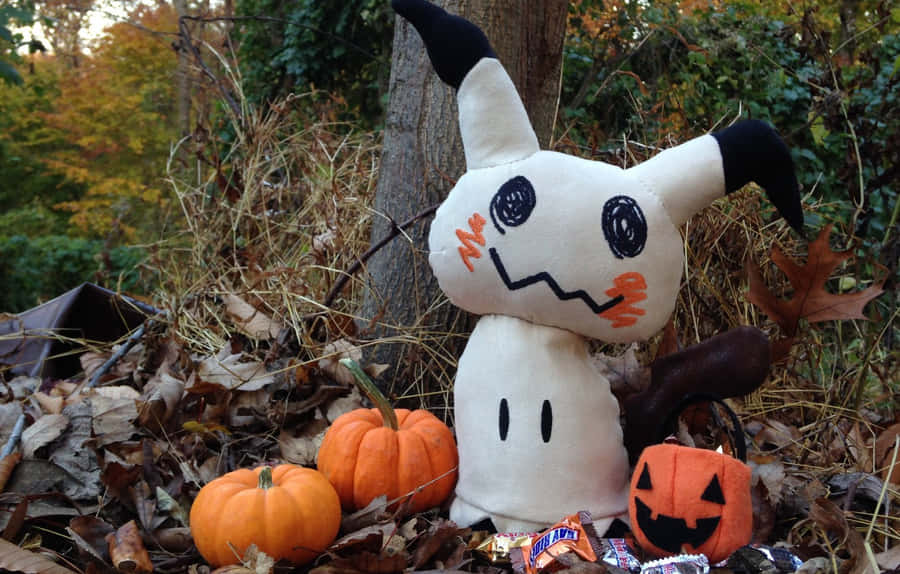 A Stuffed Animal Sitting On Leaves Wallpaper