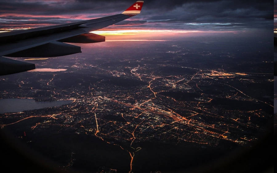 A Stunning Night Sight From A Plane Window Wallpaper