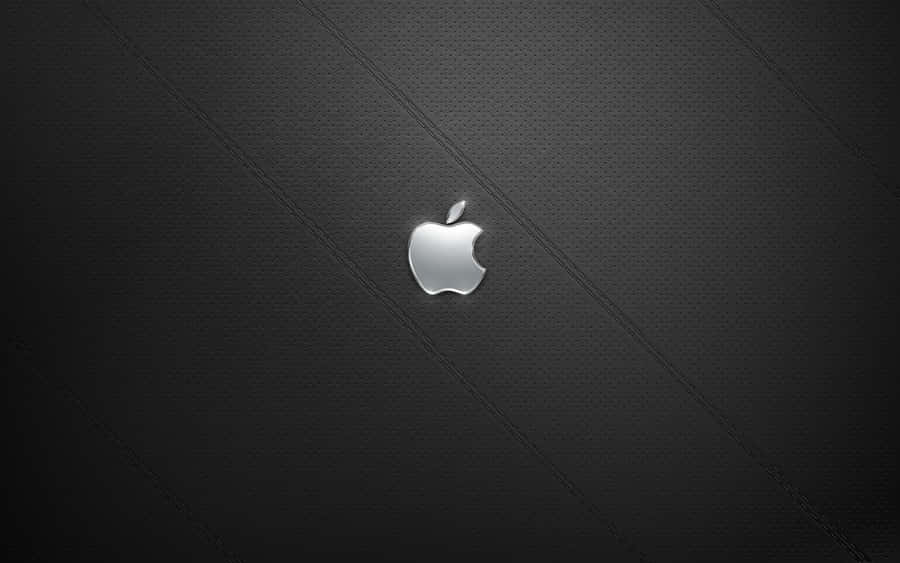A View Of A Silver Apple Desktop Set Up With A Monitor And Keyboard Wallpaper