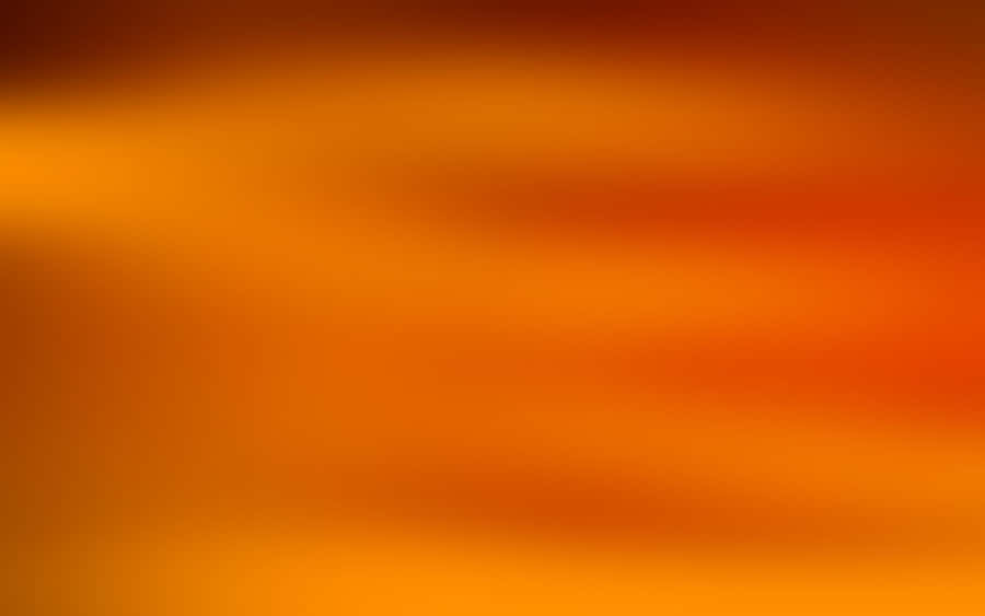 A Warm, Vibrant Sunset In Light Orange. Wallpaper