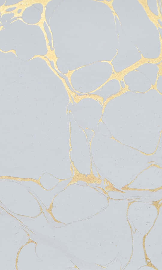 A White Marble With Gold And Silver Paint Wallpaper