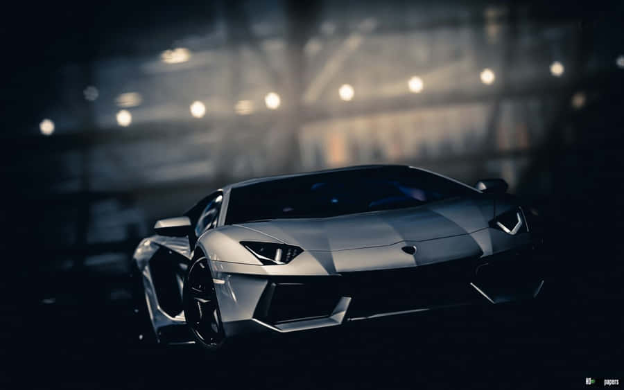 A White Sports Car In A Dark Room Wallpaper