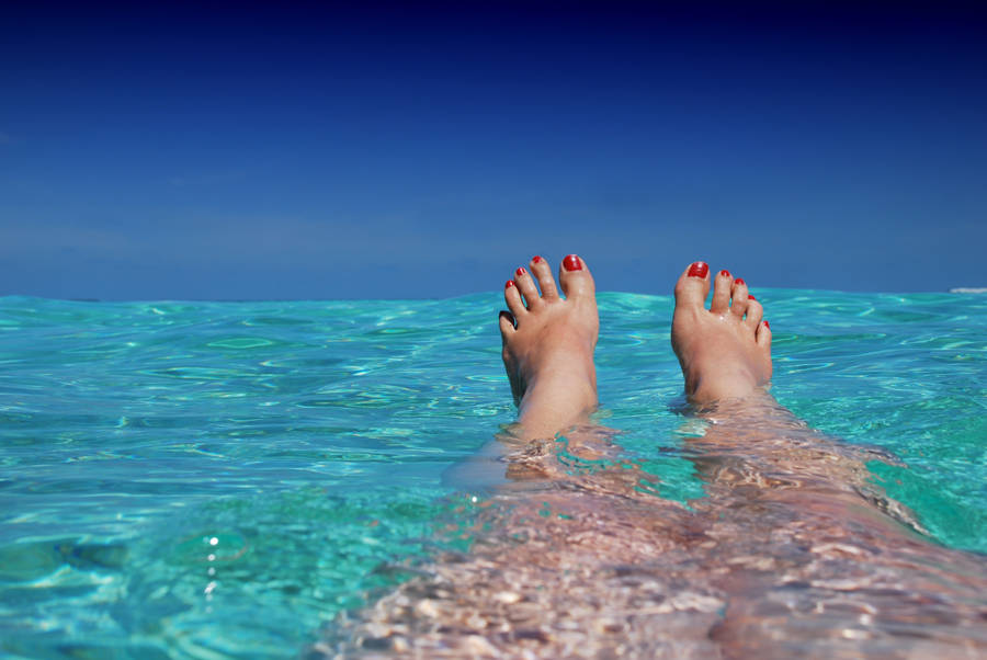 A Woman Relaxing In A Pool Wallpaper