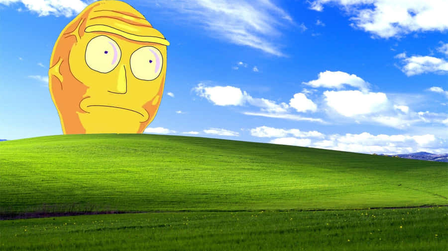 A Yellow Face On A Green Hill Wallpaper