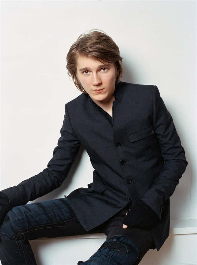 A Young Man In A Black Jacket And Jeans Wallpaper