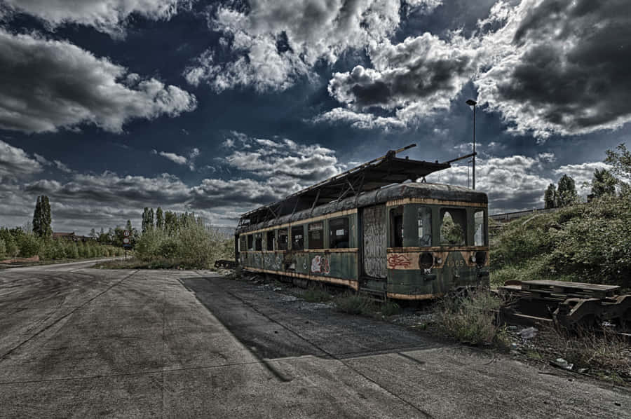 Abandoned Train Under Cloudy Sky Wallpaper