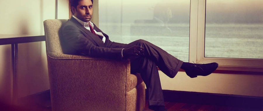 Abhishek Bachchan Sitting On Sofa Wallpaper