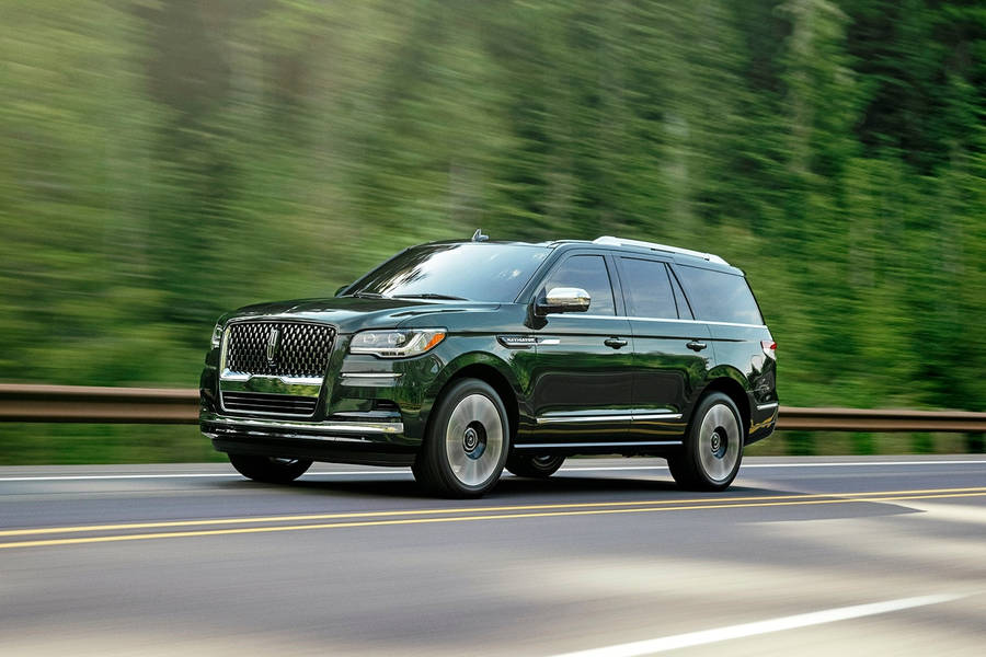 Action Shot Of A Lincoln Car Navigator Wallpaper