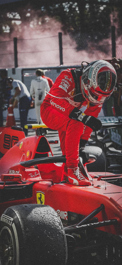 Action Shot Of F1 Driver Charles Leclerc Exiting His Racing Car Wallpaper