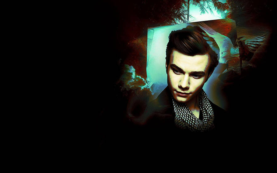 Actor Chris Colfer In Dramatic Lighting Wallpaper