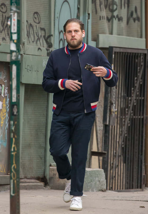 Actor Jonah Hill Showing Off His Classic Goofy Smile Wallpaper