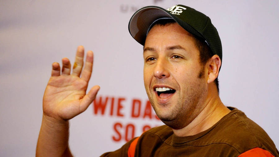 Adam Sandler Waving Happily Wallpaper