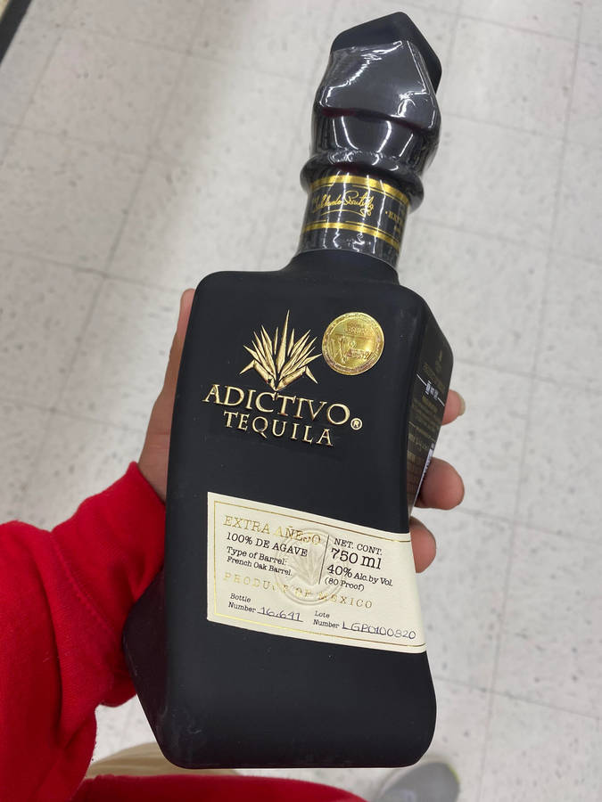 Adictivo Matte Black Tequila Bottle Wallpaper