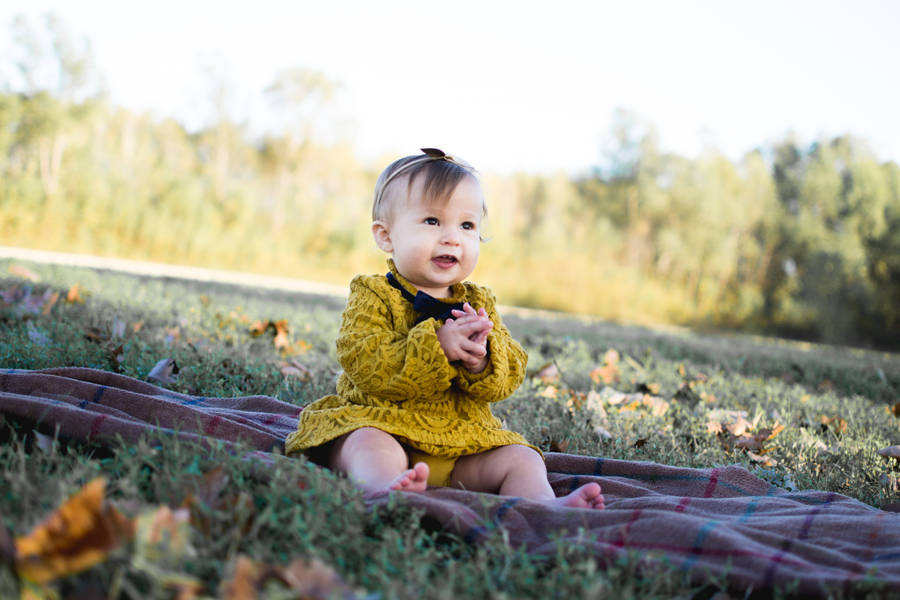 Adorable Baby Girl Enjoying Nature Wallpaper