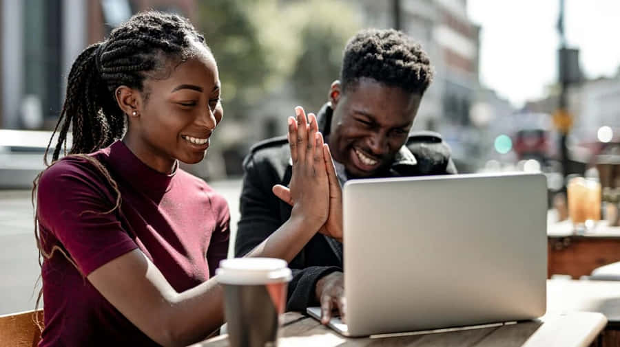 Adult Friends Giving High-five Wallpaper