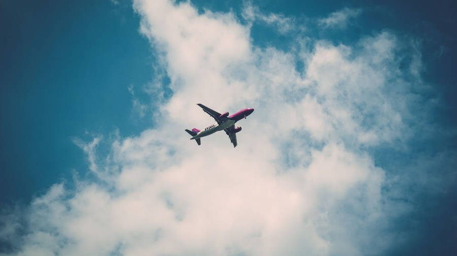 Aeroplane Dark Blue Cloudy Sky View Wallpaper