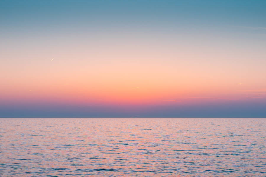 Aesthetic Sky Over Sea Of Water Wallpaper