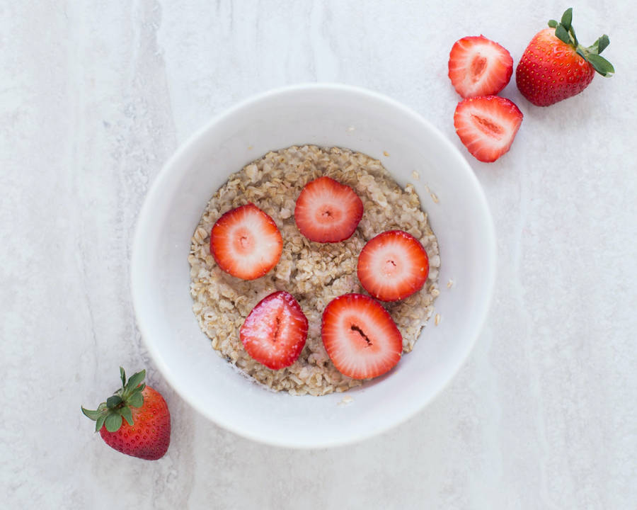 Aesthetic Strawberry Slices On Oatmeal Wallpaper