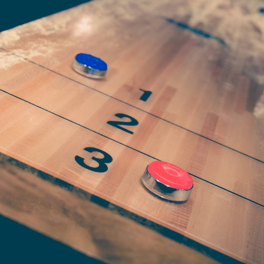 Aesthetic Vintage Shuffleboard Game With Puck Wallpaper