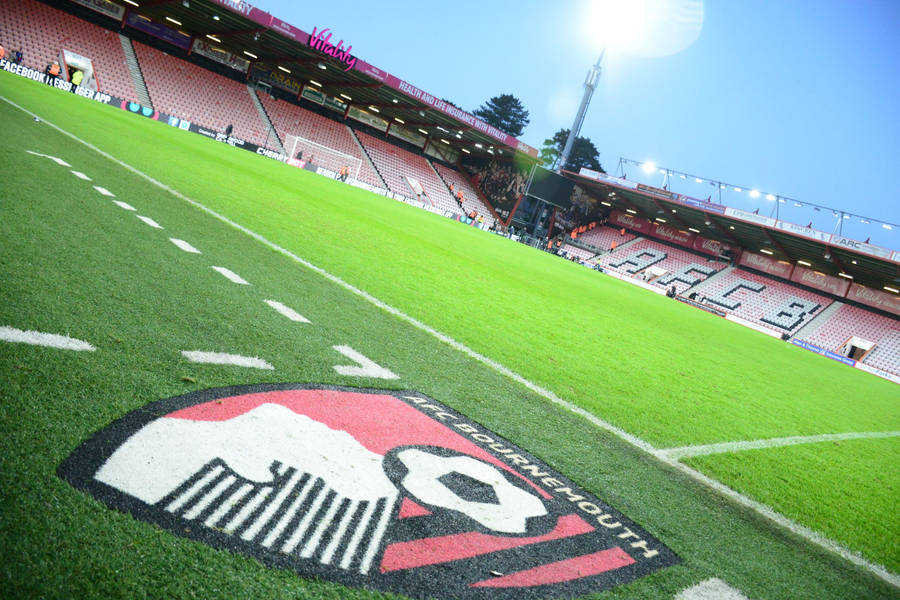 Afc Bournemouth Logo On Grass Wallpaper