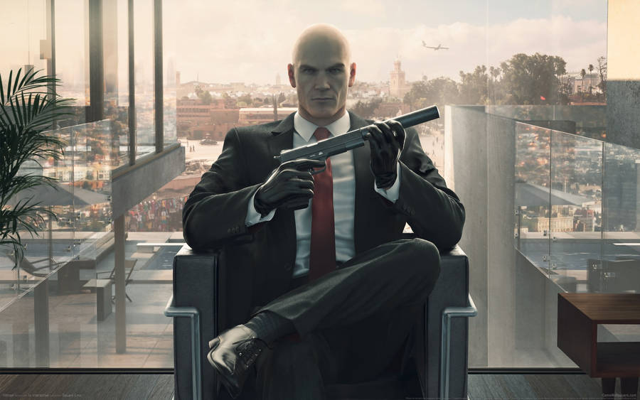 Agent 47 From The Hitman Series In A Black Suit Wallpaper
