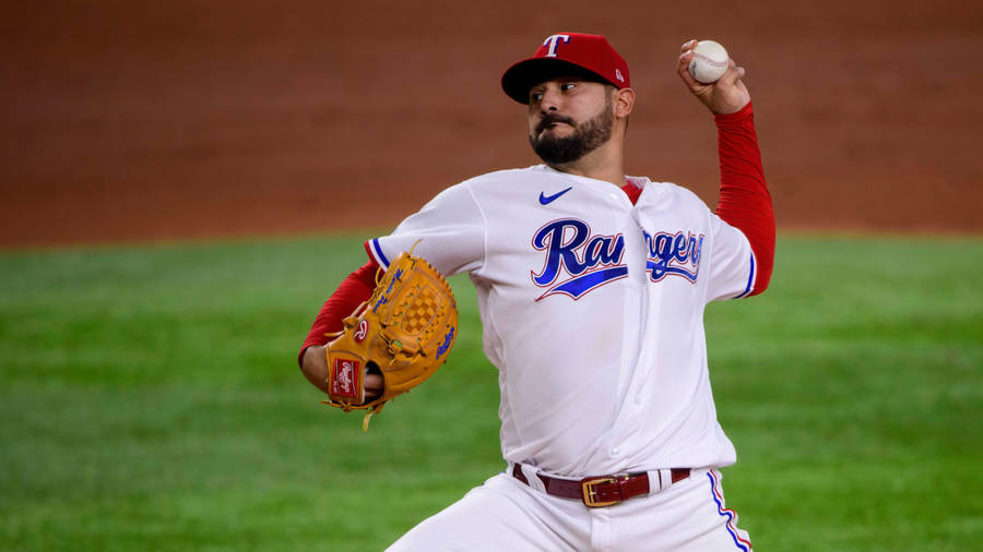 Agile Martin Perez In Mid-action On The Baseball Field Wallpaper