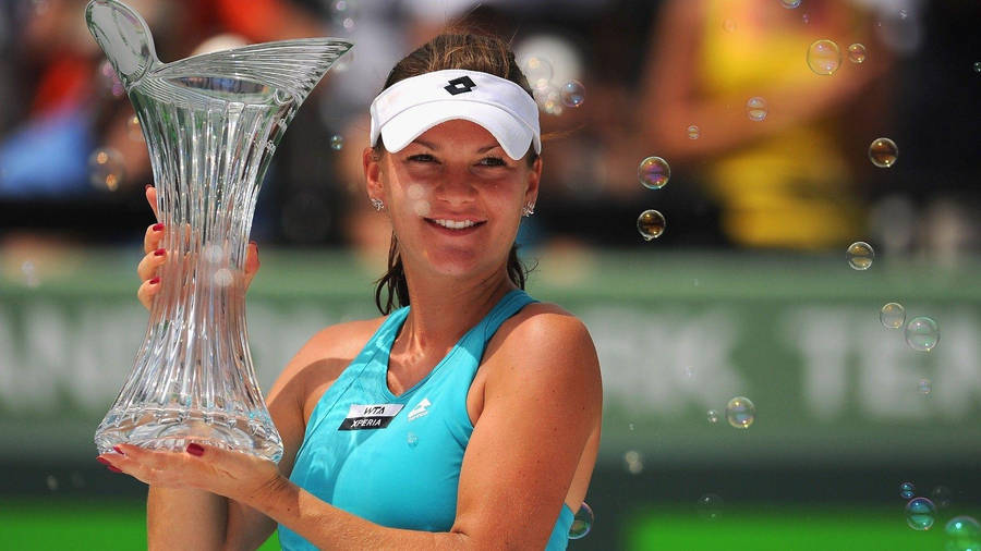 Agnieszka Radwanska Holding Her Trophy Wallpaper