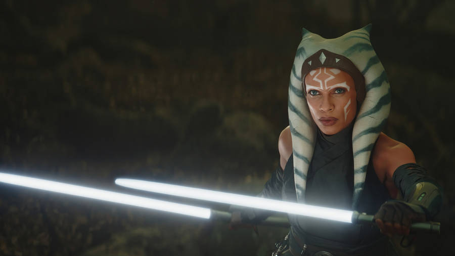 Ahsoka Tano Holding Two Lightsabers Wallpaper