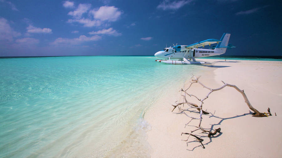 Air Taxi On White Beach Wallpaper