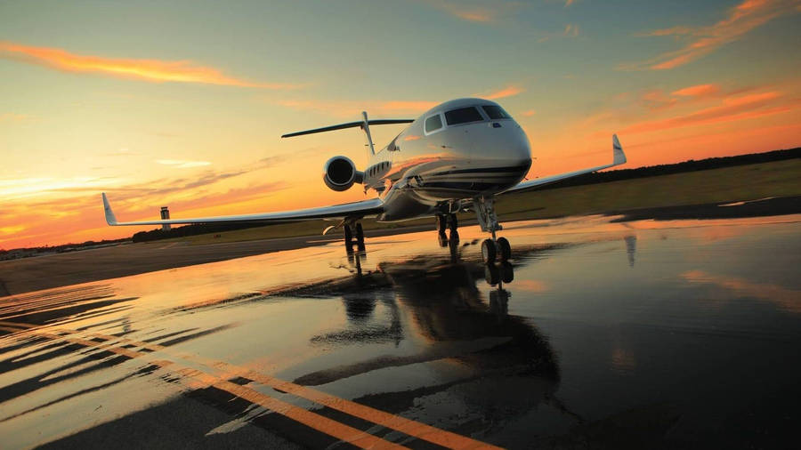 Airplane On Wet Runway Wallpaper