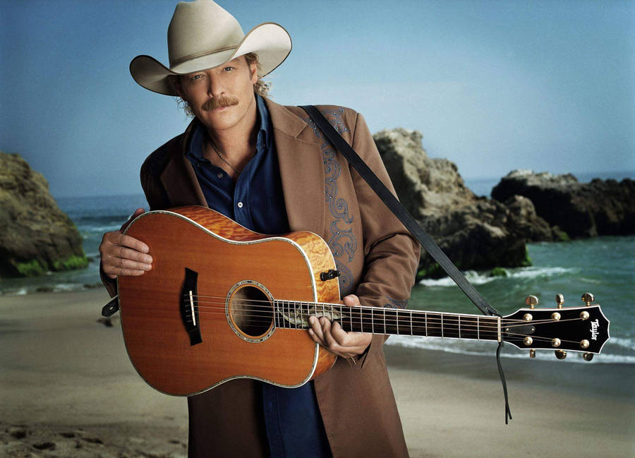 Alan Jackson By A Rocky Beach Wallpaper