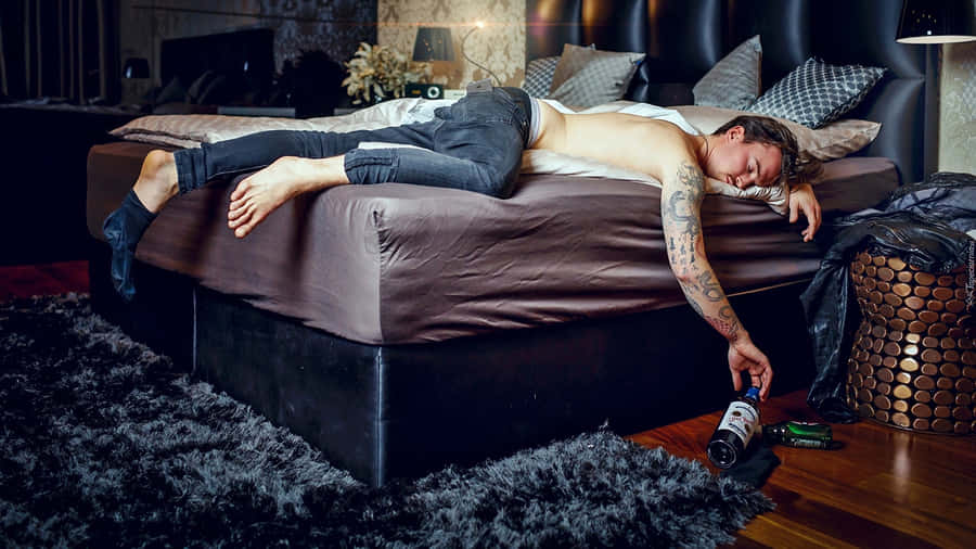 Alcoholic Person Sleeping Wallpaper