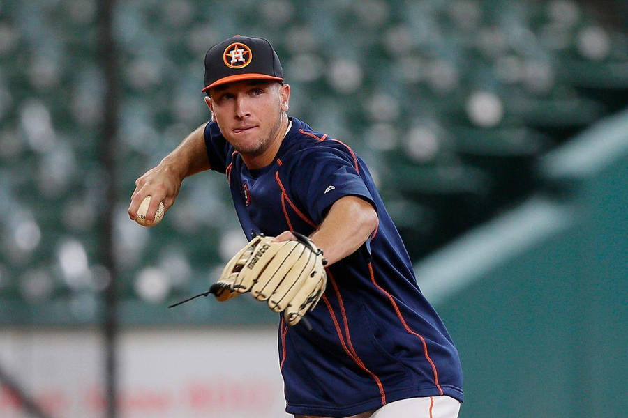 Alex Bregman Mid-throw In Dark Blue Uniform Wallpaper