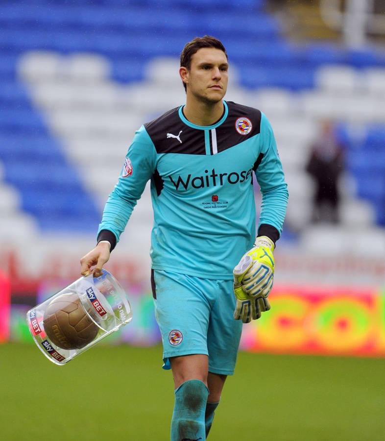 Alex Mccarthy Holding A Soccer Ball Wallpaper