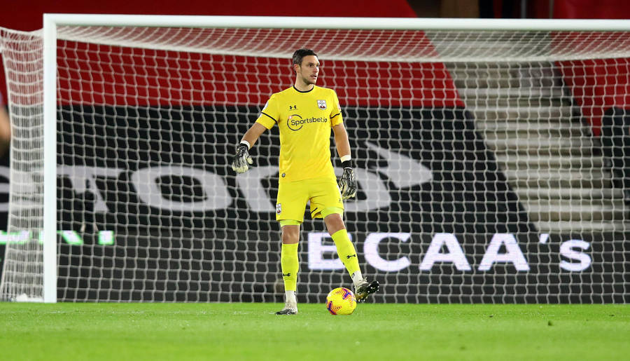 Alex Mccarthy In A Yellow Jersey Wallpaper