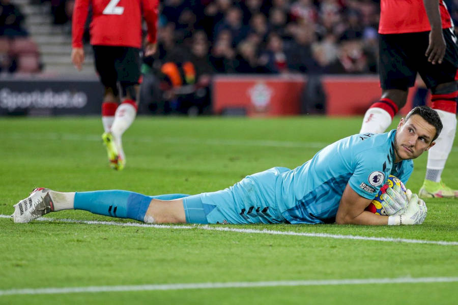 Alex Mccarthy On The Stadium Grass Wallpaper