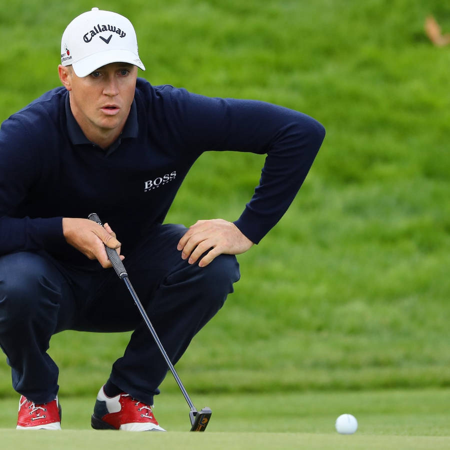 Alex Noren Crouching Down Wallpaper