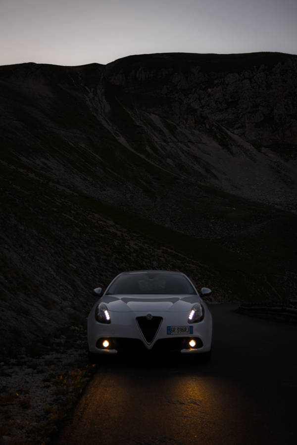 Alfa Romeo Giulietta Illuminated At Night Wallpaper