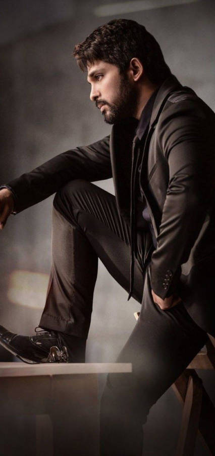 Allu Arjun Side View While Sitting Wallpaper