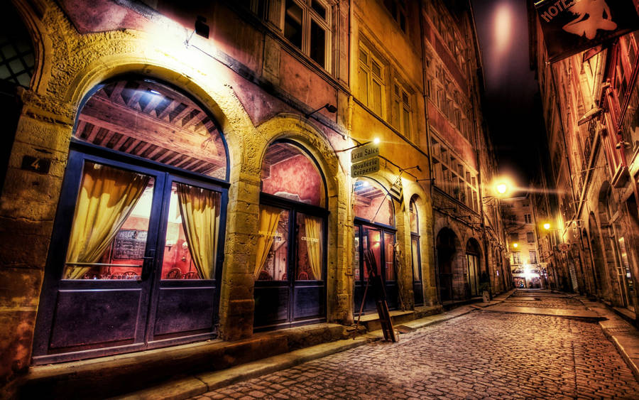 Alluring Cobblestone Street In The French Quarter Wallpaper