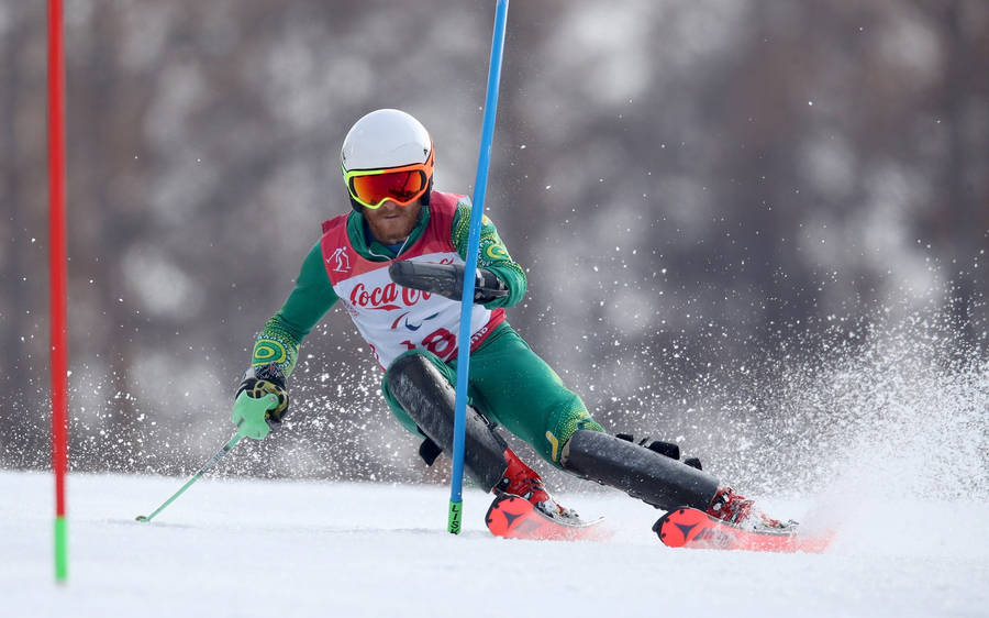 Alpine Skiing Green Suit Wallpaper